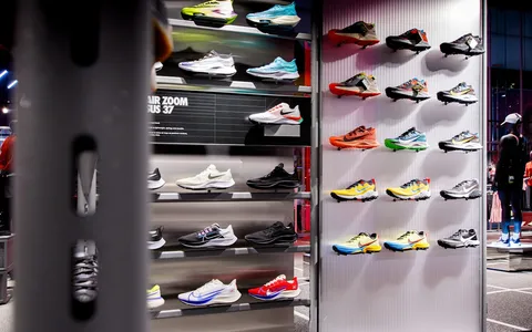 Sneaker store display with shoes on shelves